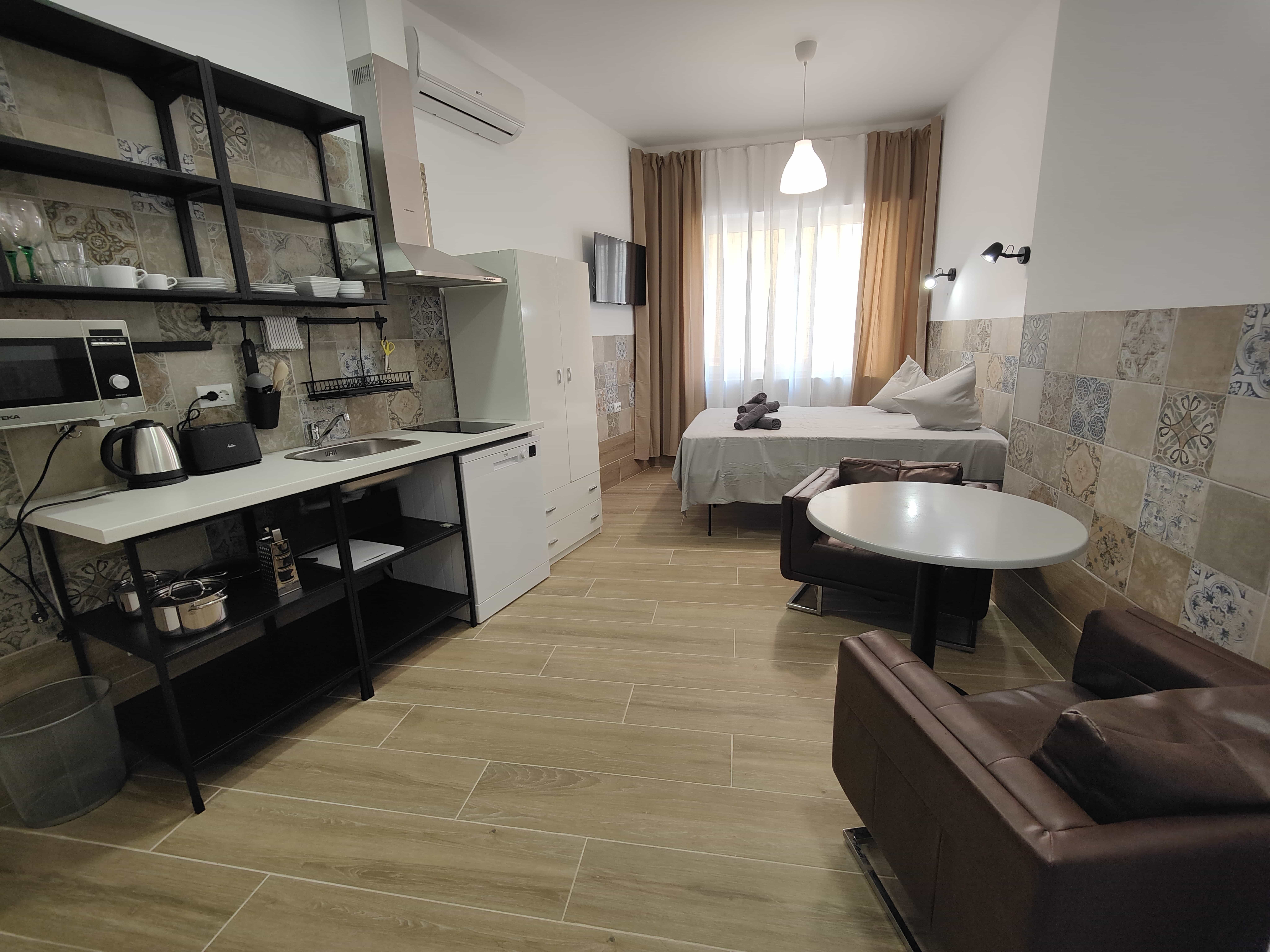 Bedroom at Apartamentos Pueblo Mar with a large window and bright natural light
