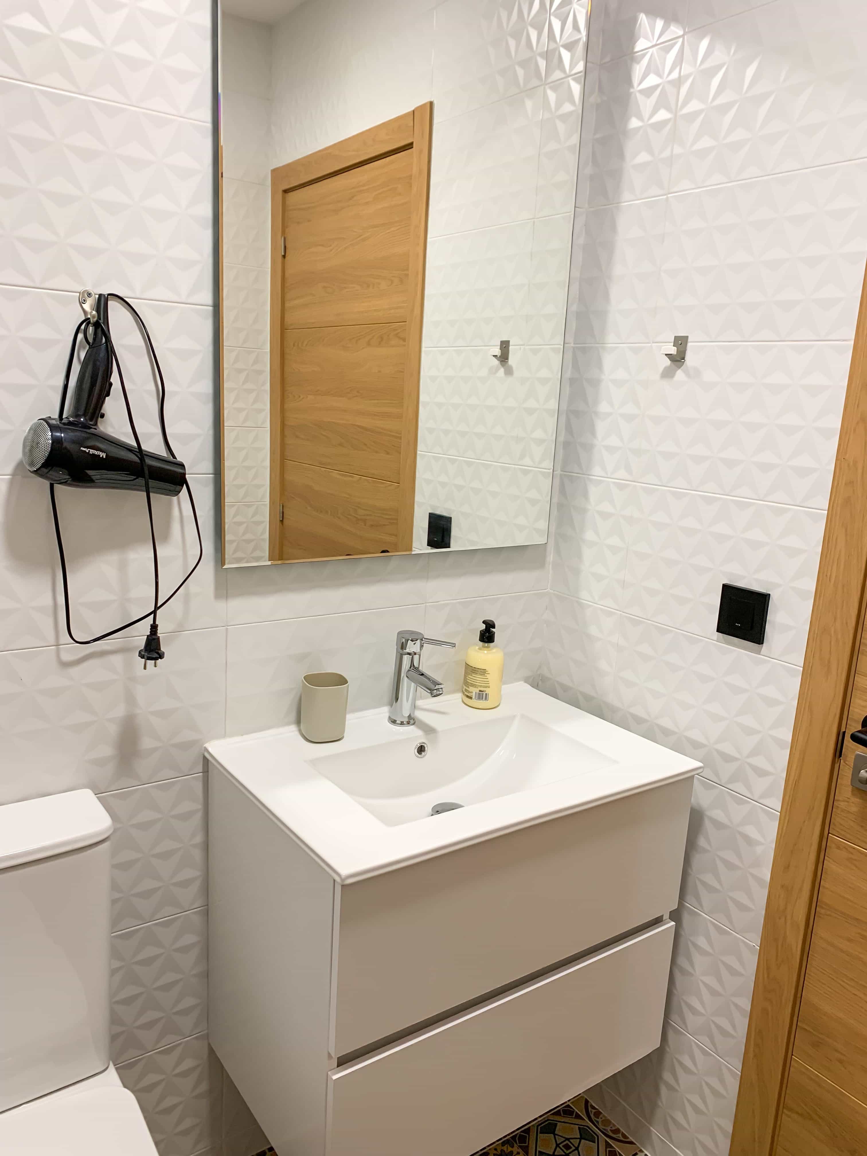 Bathroom with modern fixtures at Apartamentos La Ruta