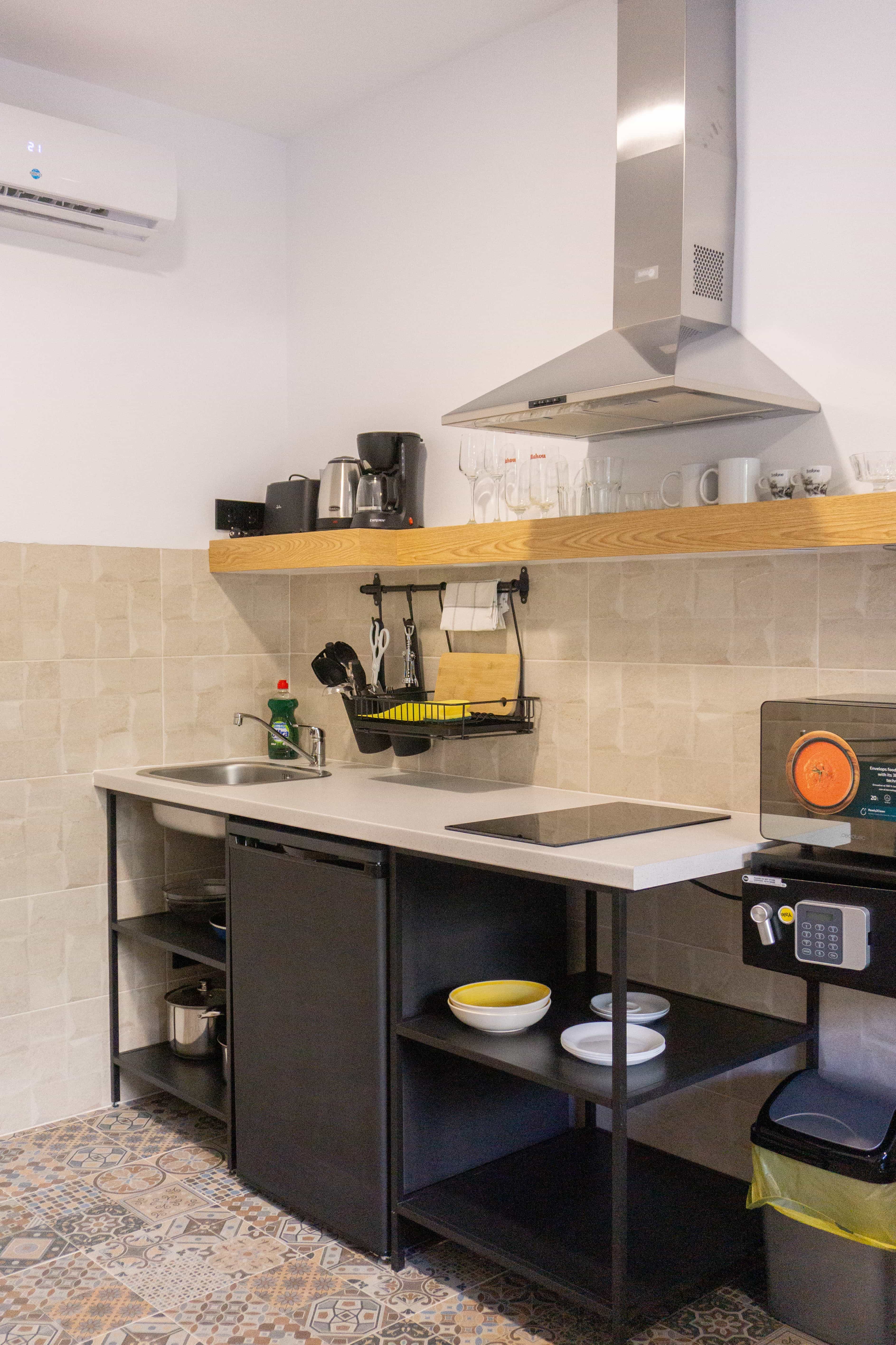 Compact kitchen and dining area at Apartamentos La Ruta